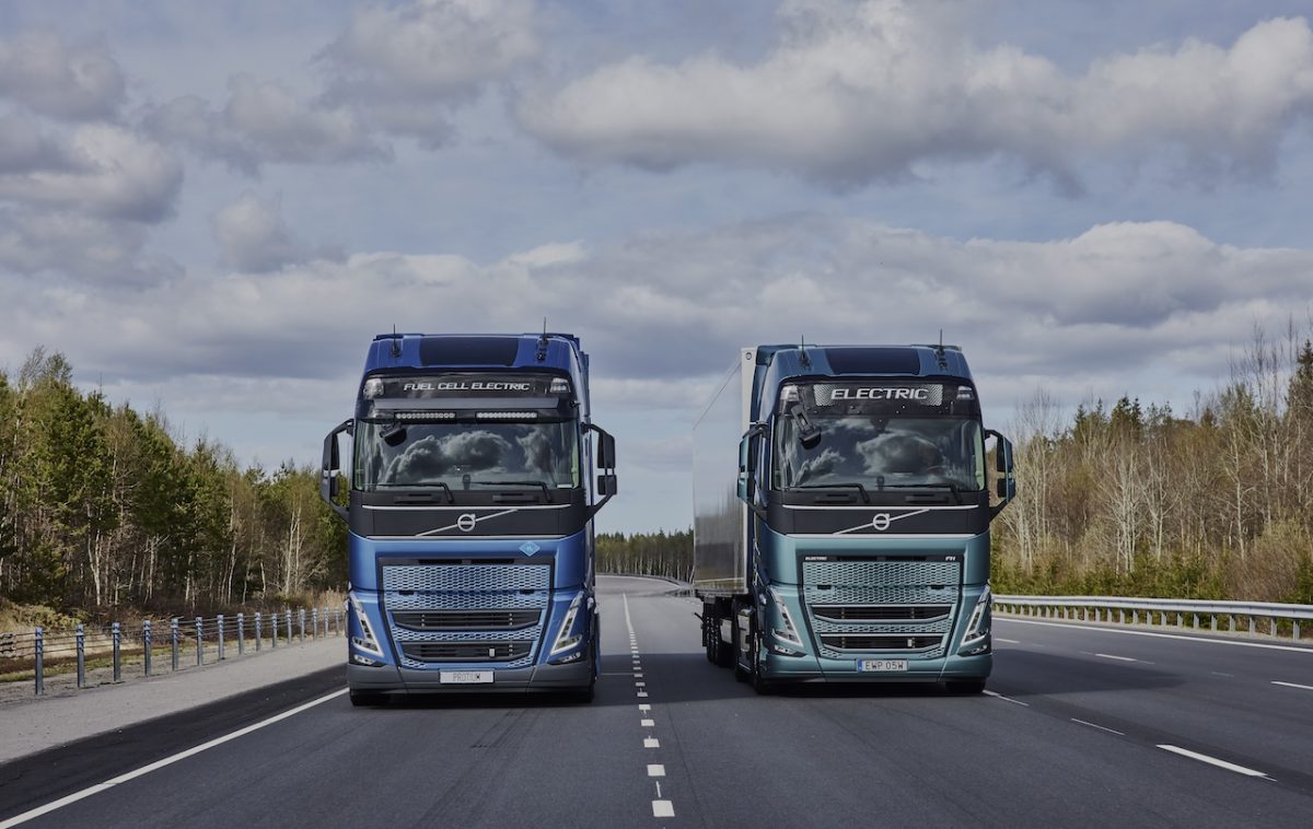 Two trucks driving side by side